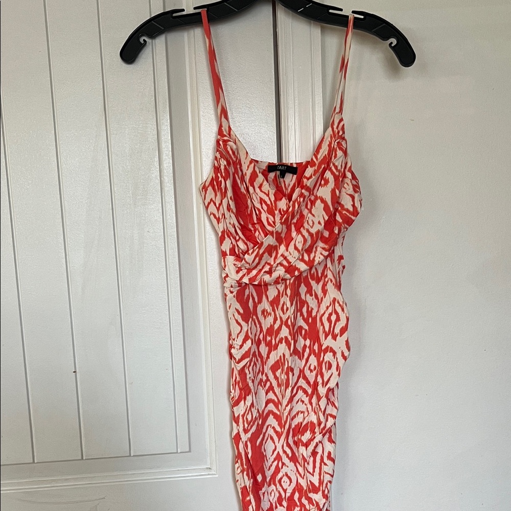 Tart Tie Dye Ikat Print Dress in Coral. Crossover neckline, ruching at sides. S.